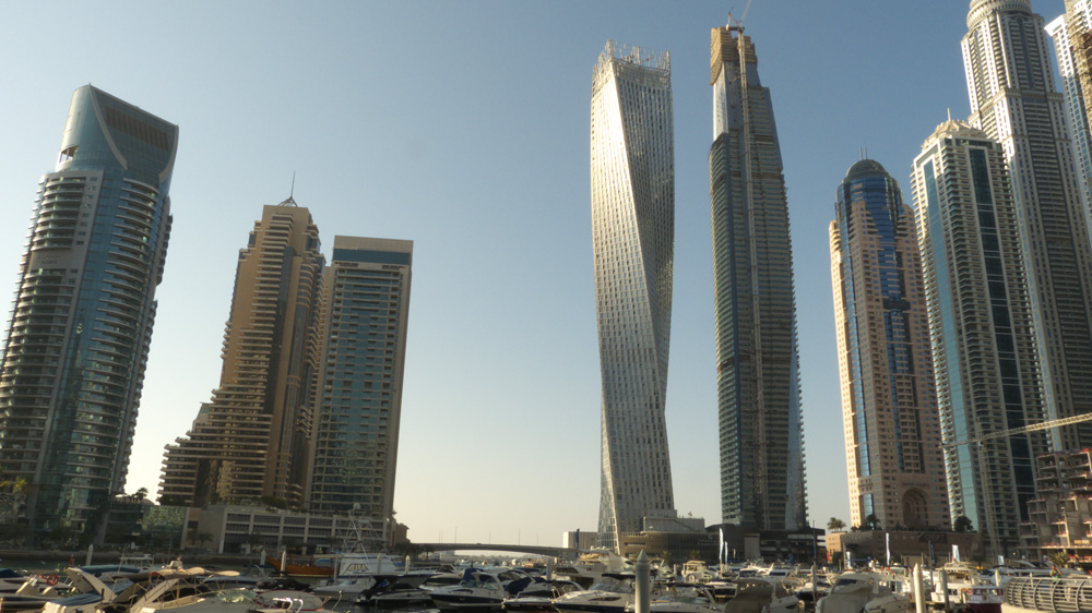 Skyscrapers on Dubai marina. From left to right: Marina Terrace, Grosvenor House West Marina Beach, Iris Blue, Cayan Tower (aka. Infinity Tower), Damac Heights, Dubai Marriott Harbour Hotel and Suites, Princess Tower, Emirates Crown.